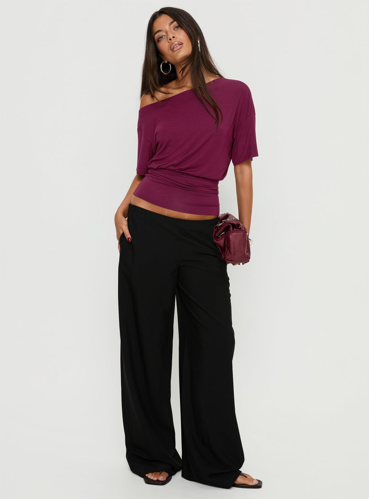 Presenting the Khane Low Rise Wide Leg Pant Black Petite in womens-regular-pants back view of model wearing