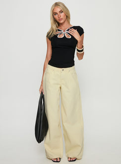 front view of model wearing Princess Polly Ramos Low Rise Wide Leg Denim Jeans Butter Lemon Low Rise Jeans Jeans 