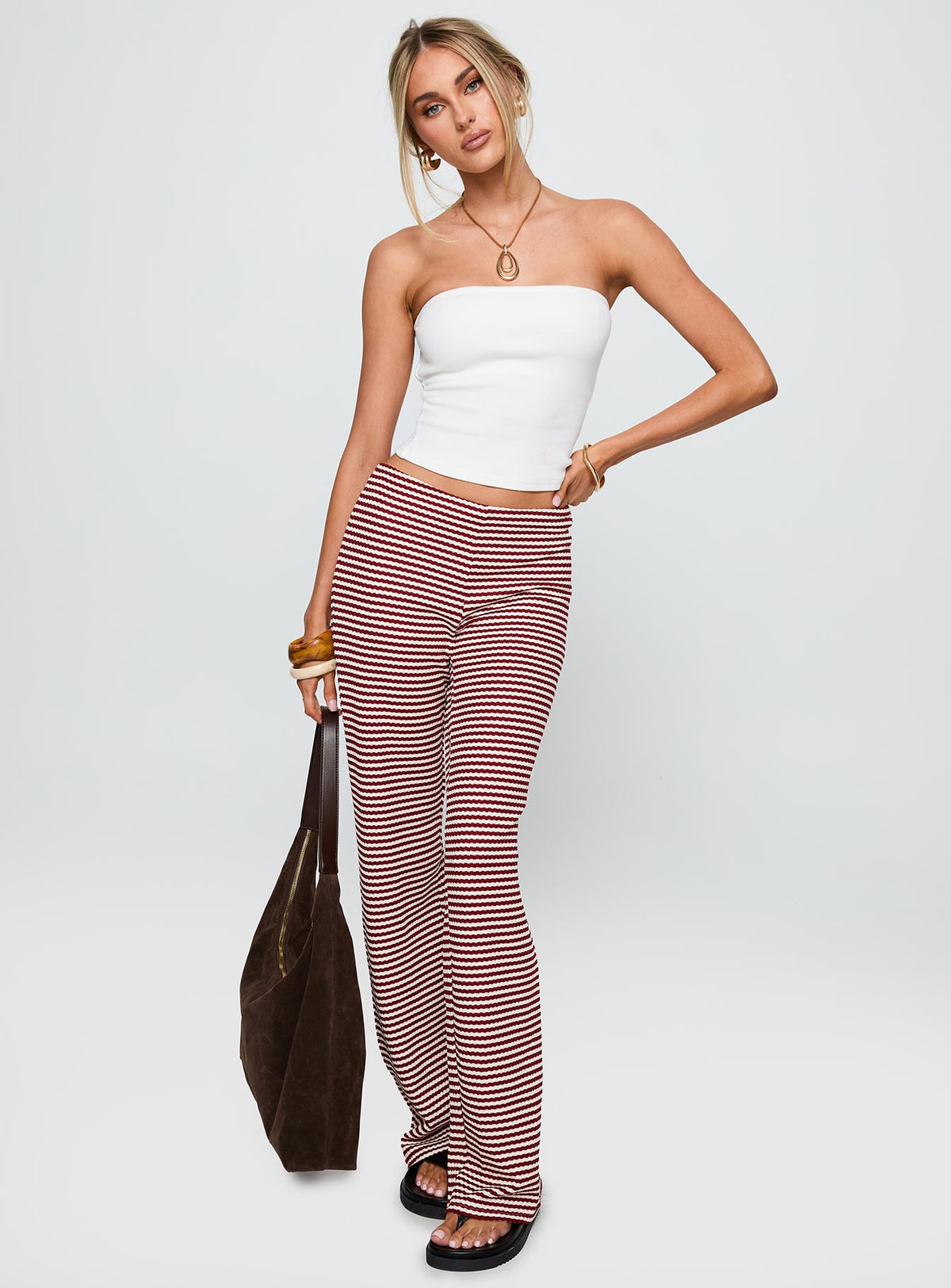 front view of model wearing Princess Polly Next To Me Lounge Pant Red / White Stripe Low Rise Pants Pants 