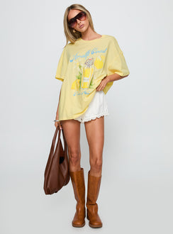 back view of model wearing Princess Polly Amalfi Coast Oversized Graphic Tee Pastel Yellow Half Sleeves Crew Neck 