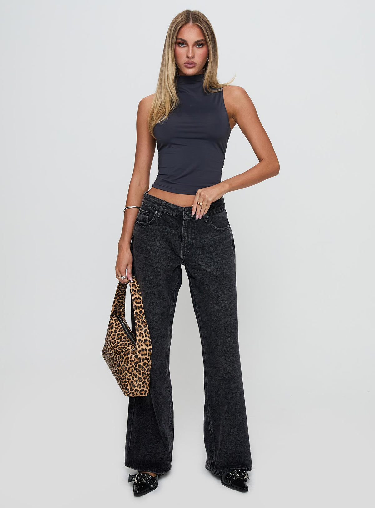 front view of model wearing Princess Polly Serenitia Mid Rise Relaxed Leg Jeans Washed Black Petite Mid Rise Jeans Jeans 