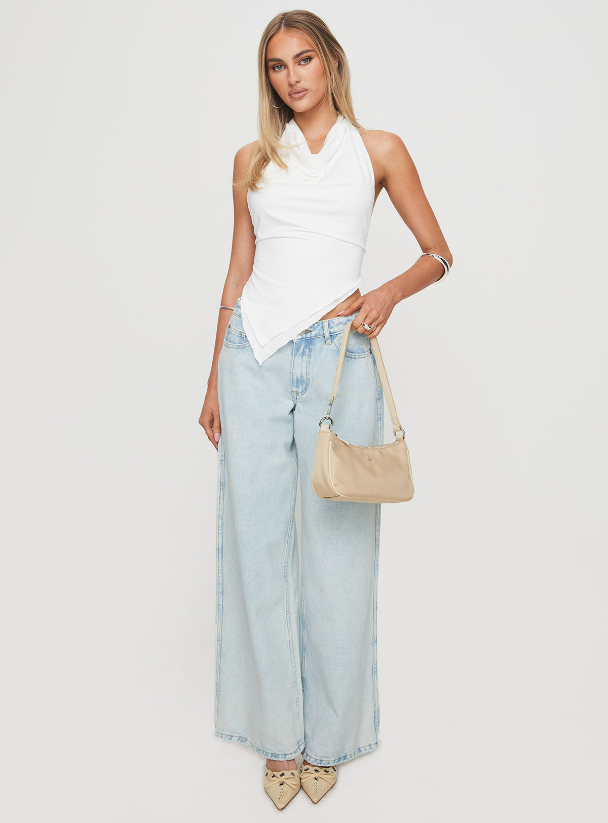 front view of model wearing Princess Polly Brayden Low Rise Relaxed Jeans Light Acid Wash Low Rise Jeans Jeans 