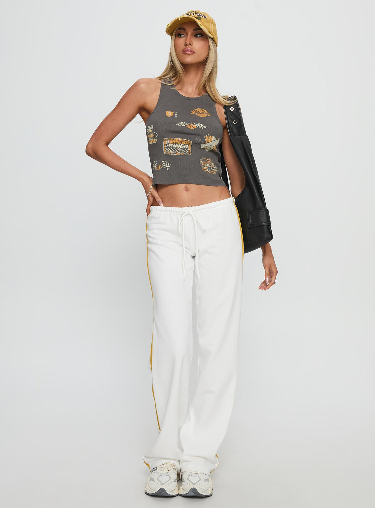 front view of model wearing Princess Polly Elation Low Rise Straight Leg Track Pant White Low Rise Pants Pants 