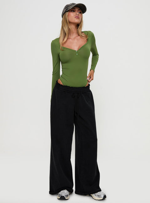 front view of model wearing Princess Polly Delgado Long Sleeve Bodysuit Olive Long Sleeve Tops Bodysuit 