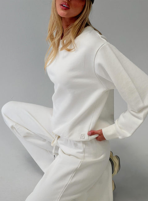 side view of model wearing Princess Polly Wellness Off The Shoulder Jumper Washed White Jumpers 