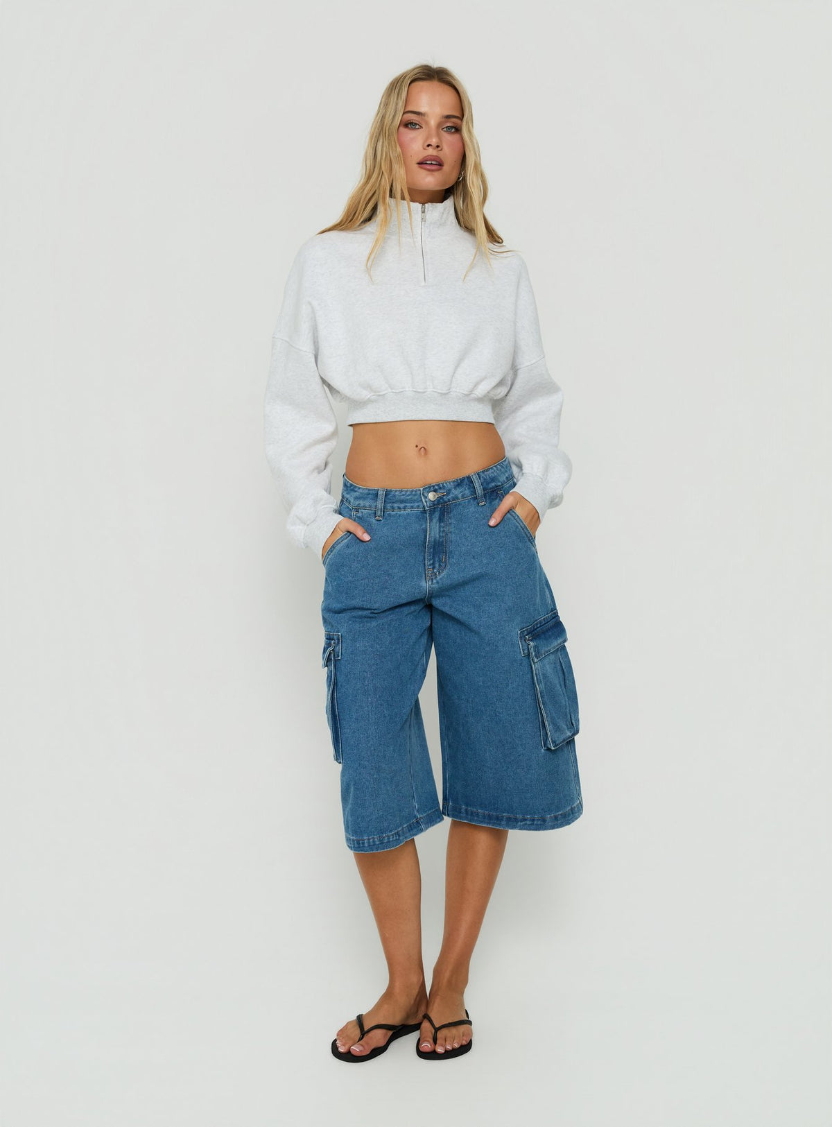 Crafted from the Astridd 3/4 Zip Cropped Jumper Grey Marle womens jumper with short length on-body view of model wearing Princess Polly