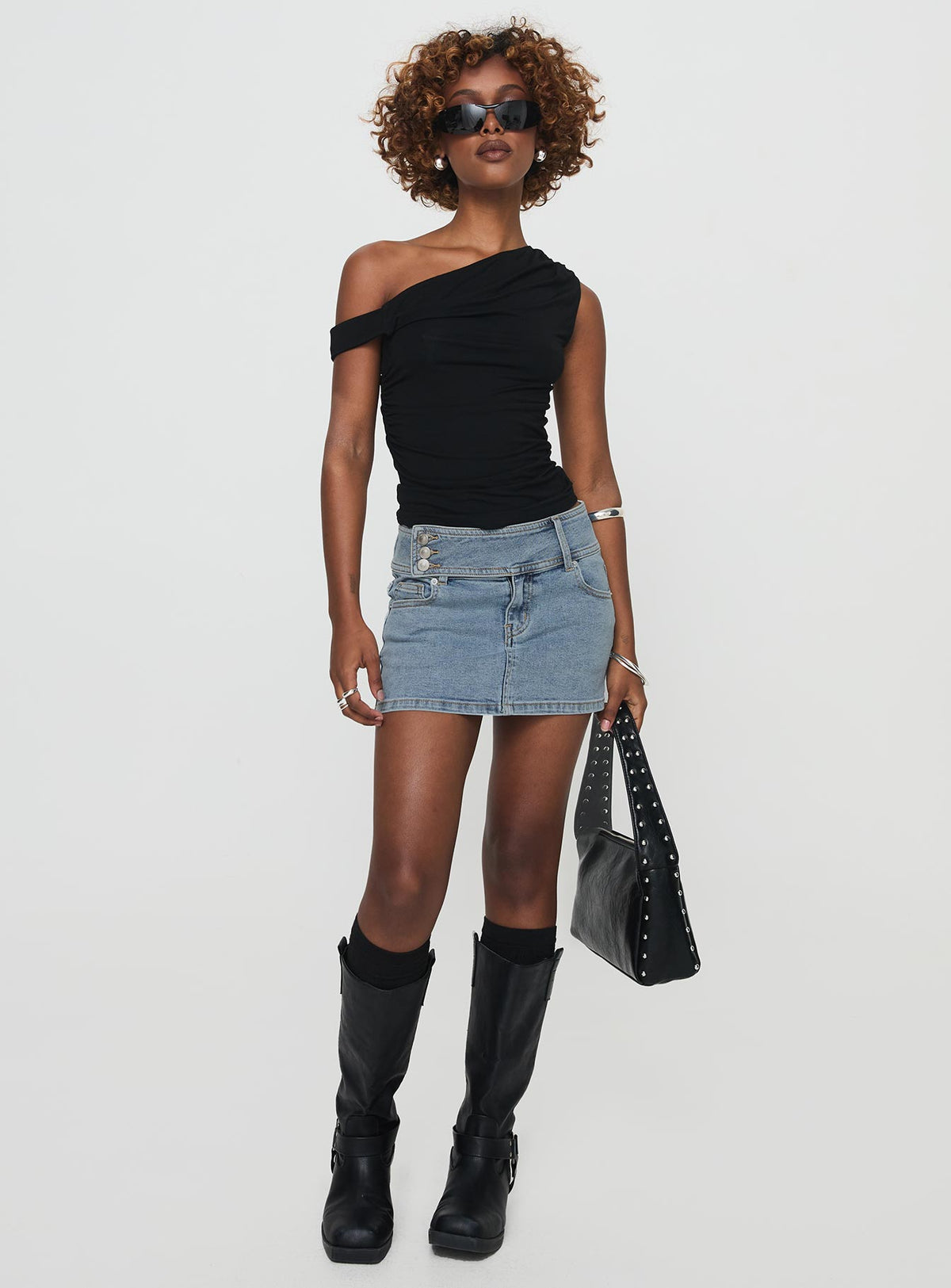   front view of model wearing Princess Polly Brinkman Mini Skirt Light Wash Denim Mini Skirts Skirts 