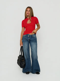 Showcasing Celinia Mid Rise Asymmetrical Baggy Jeans Dark Indigo womens-jeans with mid-rise front view of model wearing Princess Polly