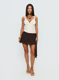   front view of model wearing Princess Polly Reviva Ruched Wrap Mini Skirt Chocolate Mini Skirts Skirts 