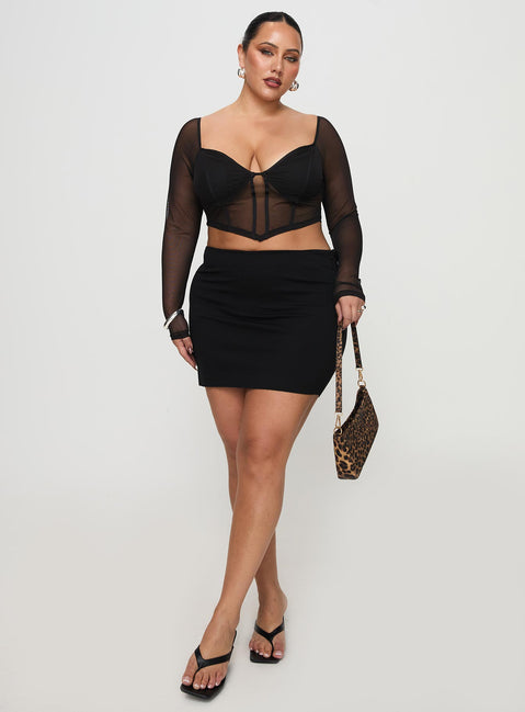   side view of model wearing Princess Polly Karley Low Waist Mini Skirt Black Curve Mini Skirts Skirts 