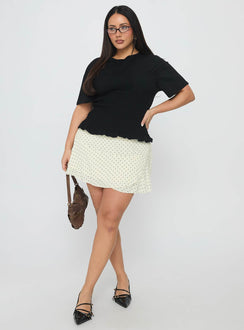   side view of model wearing Princess Polly Sonsie Mini Skirt Cream Curve Skirts 