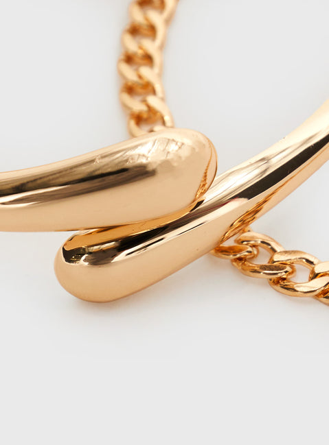 Gold-toned bracelet pack Two-piece set, chain bracelet with lobster clasp fastening, hinge fastening cuff