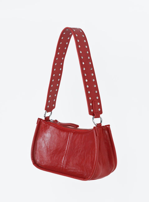 Bag Faux leather material  Vintage style  Zip fastening  Studded removable shoulder strap  Adjustable and removable crossbody strap  Inner zip pocket  Flat base 