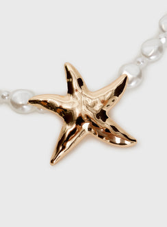 Necklace Beaded pear design, gold-toned star detail, lobster clasp fastening