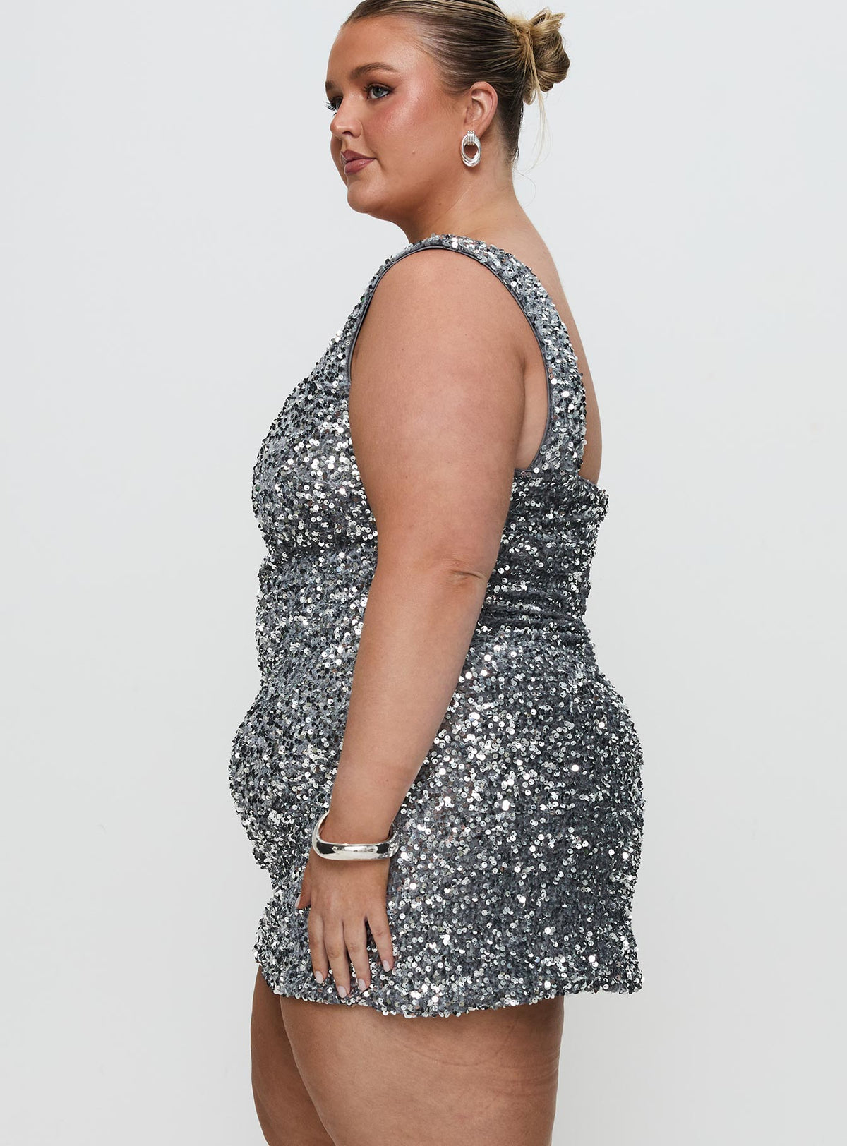 side view of model wearing Princess Polly Miss Me Sequin Mini Dress Silver Curve Square Neck 