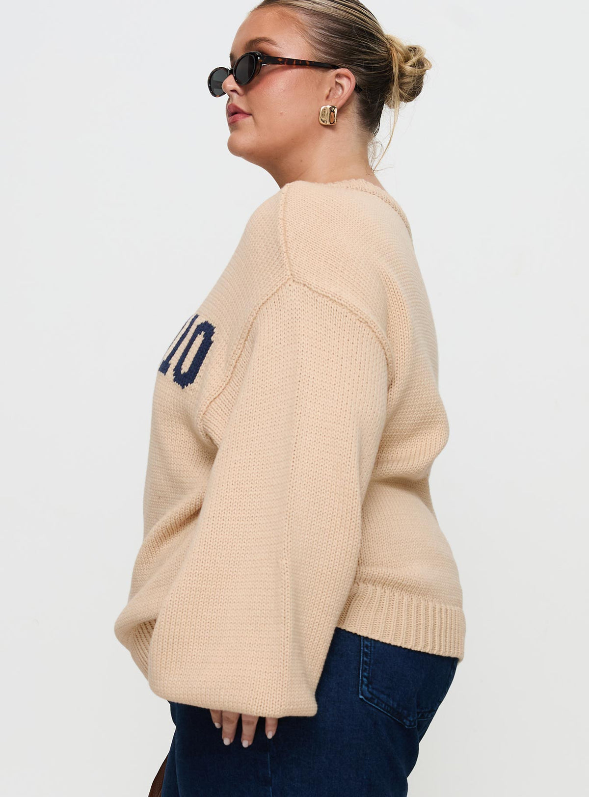 side view of model wearing Princess Polly Jadynn Off Shoulder Knit Sweater Cream Curve Jumpers 