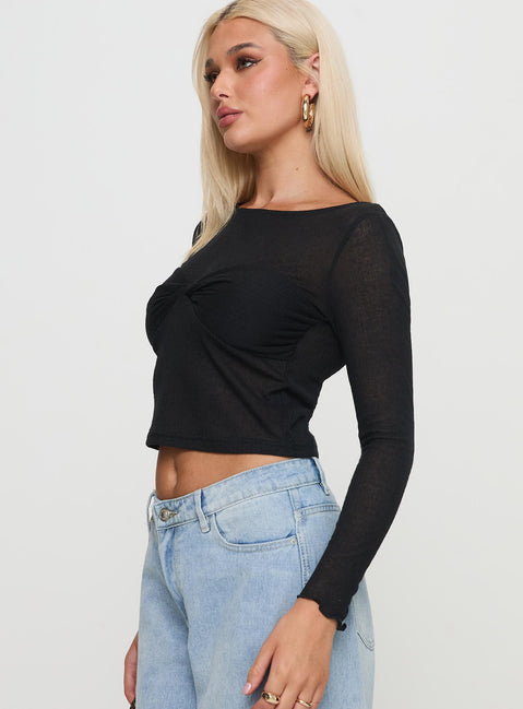 side view of model wearing Princess Polly November Long Sleeve Top Black Full Sleeves Boat Neck 