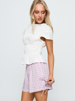 side view of model wearing Princess Polly Bubbia Tie Up Shorts Purple / White 