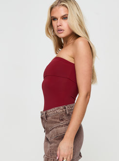 side view of model wearing Princess Polly Niner Strapless Bodysuit Burgundy Sleeveless Bodysuit 