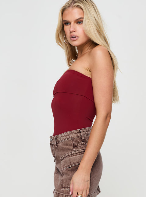 side view of model wearing Princess Polly Niner Strapless Bodysuit Burgundy Sleeveless Bodysuit 