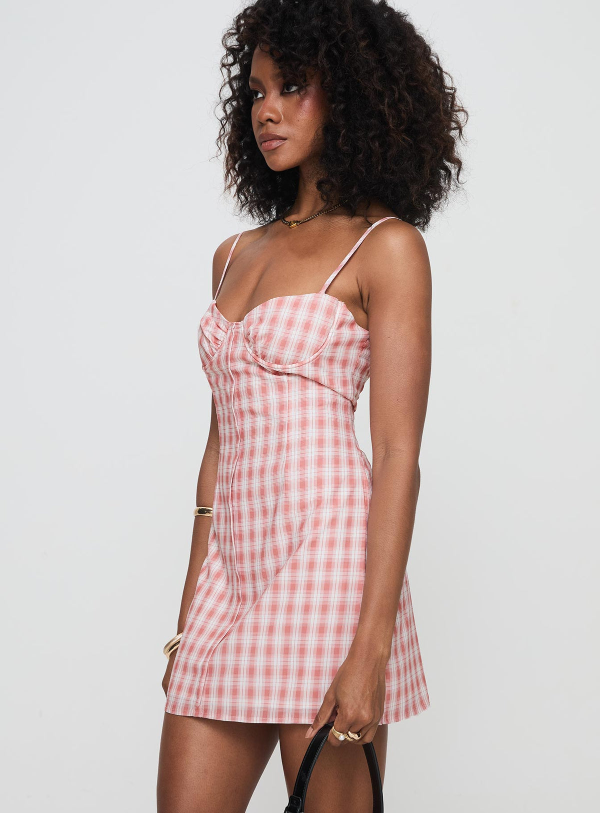 side view of model wearing Princess Polly Poto Mini Dress Pink Check Sweetheart Neckline 