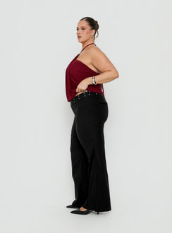 Presenting the Yevina Eyelet Flare Pant Black Curve womens-regular-pants with mid-rise side view of model wearing Princess Polly