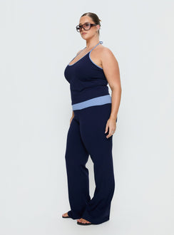 side view of model wearing Princess Polly Kobee Jersey Flare Pants Navy / Light Blue Curve High Rise Pants Pants 