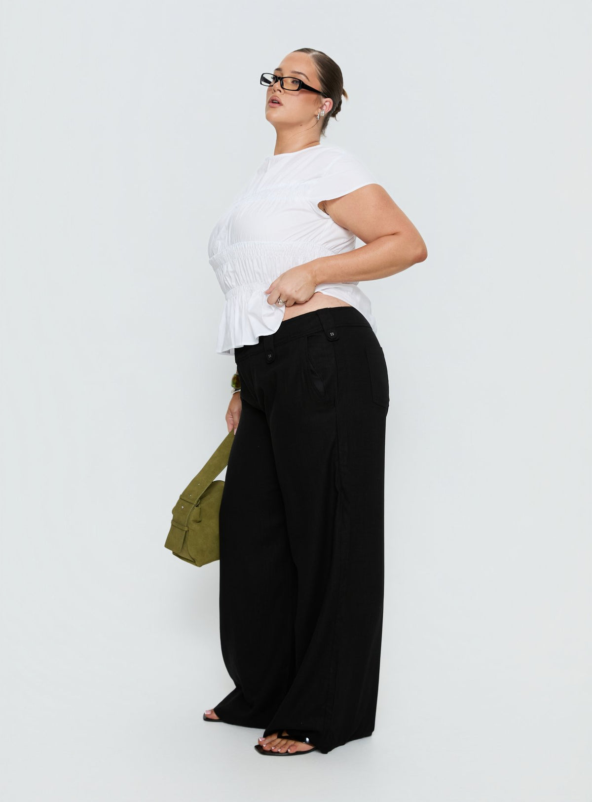 side view of model wearing Princess Polly Pedra Wide Leg Pant Black Curve Mid Rise Pants Pants 