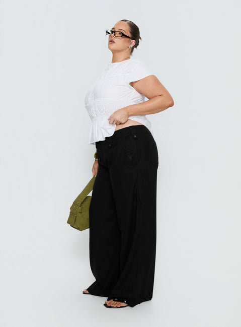 side view of model wearing Princess Polly Pedra Wide Leg Pant Black Curve Mid Rise Pants Pants 