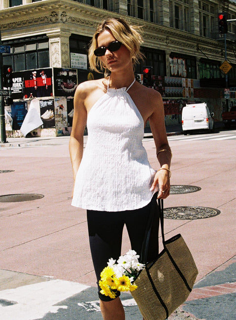 side view of model wearing Princess Polly Flutter Halter Top White Sleeveless High Neck 