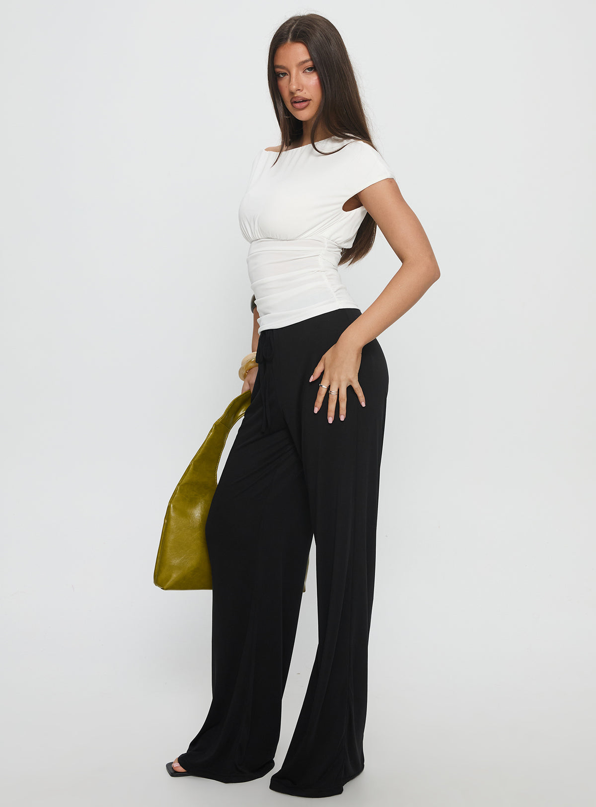 side view of model wearing Princess Polly Gavrielle Jersey Wide Leg Pants Black High Rise Pants Pants 