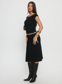   side view of model wearing Princess Polly Baseline Rib Midi Skirt Black Midi Skirts Skirts 