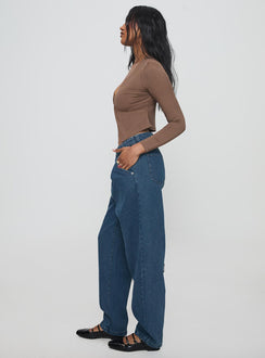 side view of model wearing Princess Polly Forestier Mid Rise Barrel Leg Pin Tuck Jeans Mid Blue High Rise Jeans Jeans 