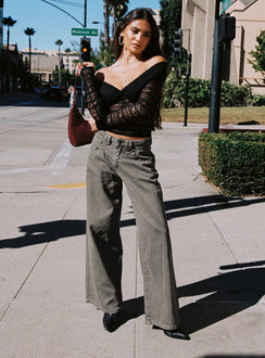 back view of model wearing Princess Polly West Side Mid Rise Wide Leg Jeans Grey Wash Mid Rise Jeans Jeans 