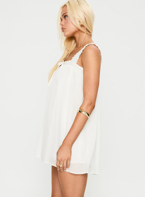 side view of model wearing Princess Polly Cupids Bow Mini Dress White Square Neck 