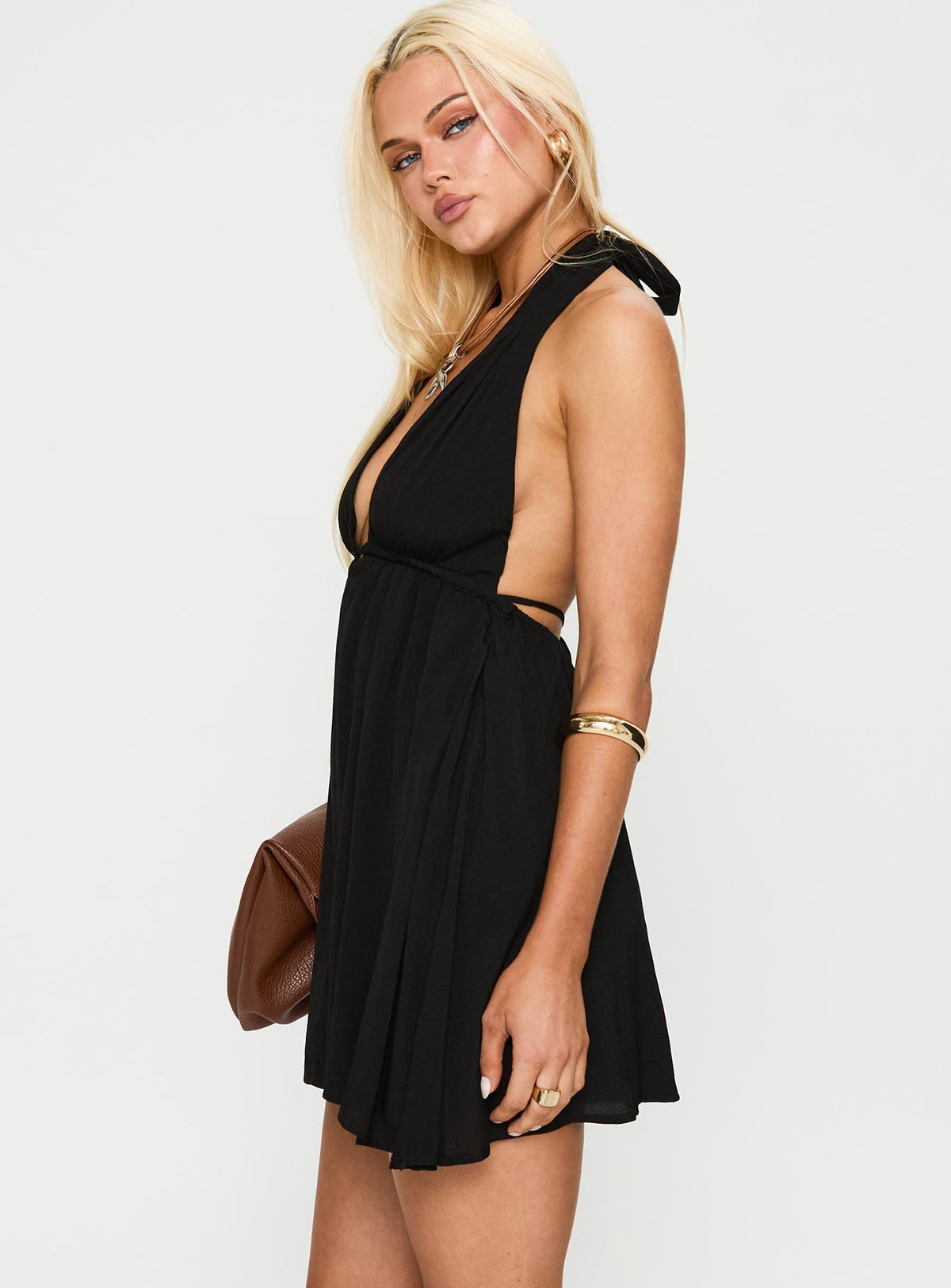 side view of model wearing Princess Polly Saddler Mini Dress Black Plunger 
