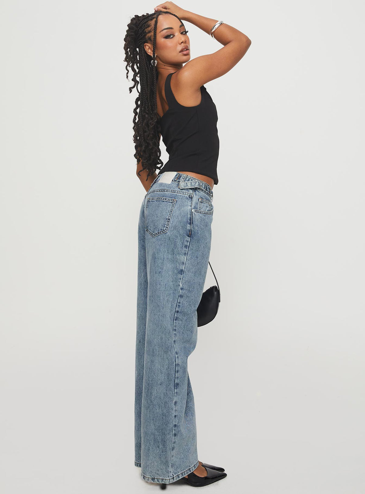 side view of model wearing Princess Polly Sidle Low Rise Straight Leg Jeans Light Wash Low Rise Jeans Jeans 