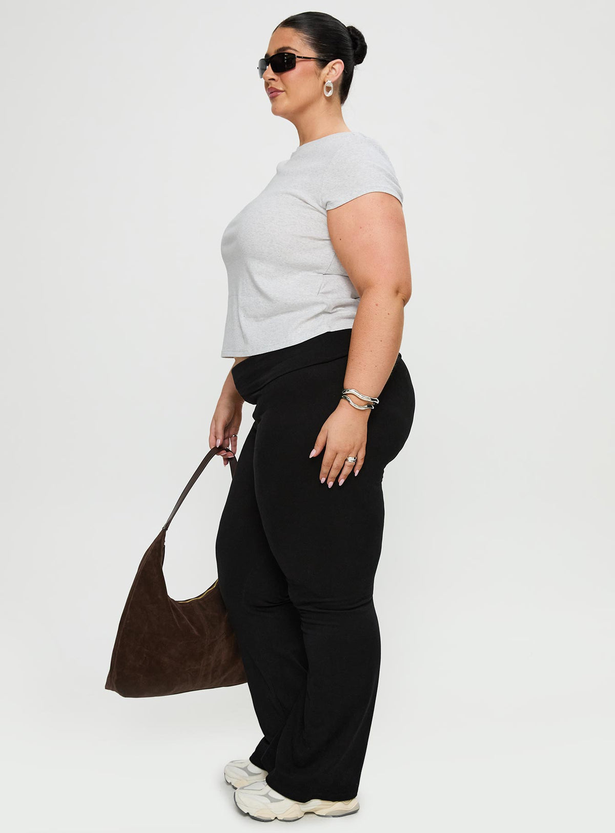 side view of model wearing Princess Polly Movement Yoga Pant Black Curve High Rise Pants Pants 