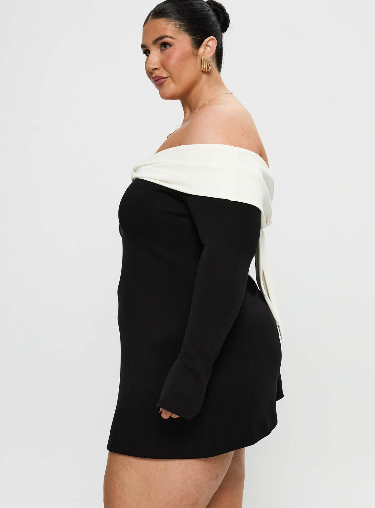 side view of model wearing Princess Polly Distractions Off The Shoulder Mini Dress Multi Curve High Neck 