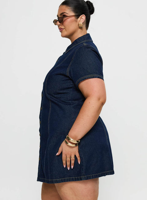 side view of model wearing Princess Polly Perception Denim Mini Dress Mid Wash Curve V-Neck 