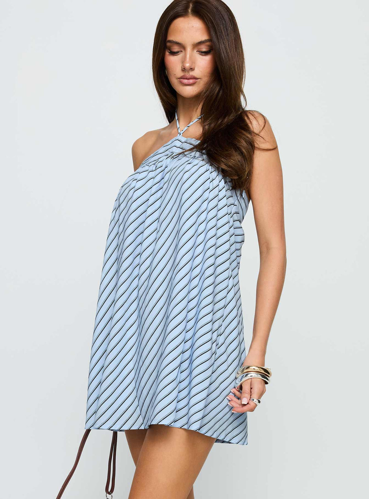 side view of model wearing Princess Polly Moonlit Mini Dress Blue Stripe Asymmetric Neckline 