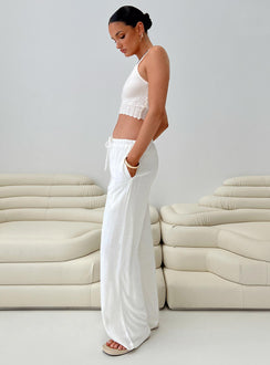 side view of model wearing Princess Polly Parklea Pants White Tall Pants 