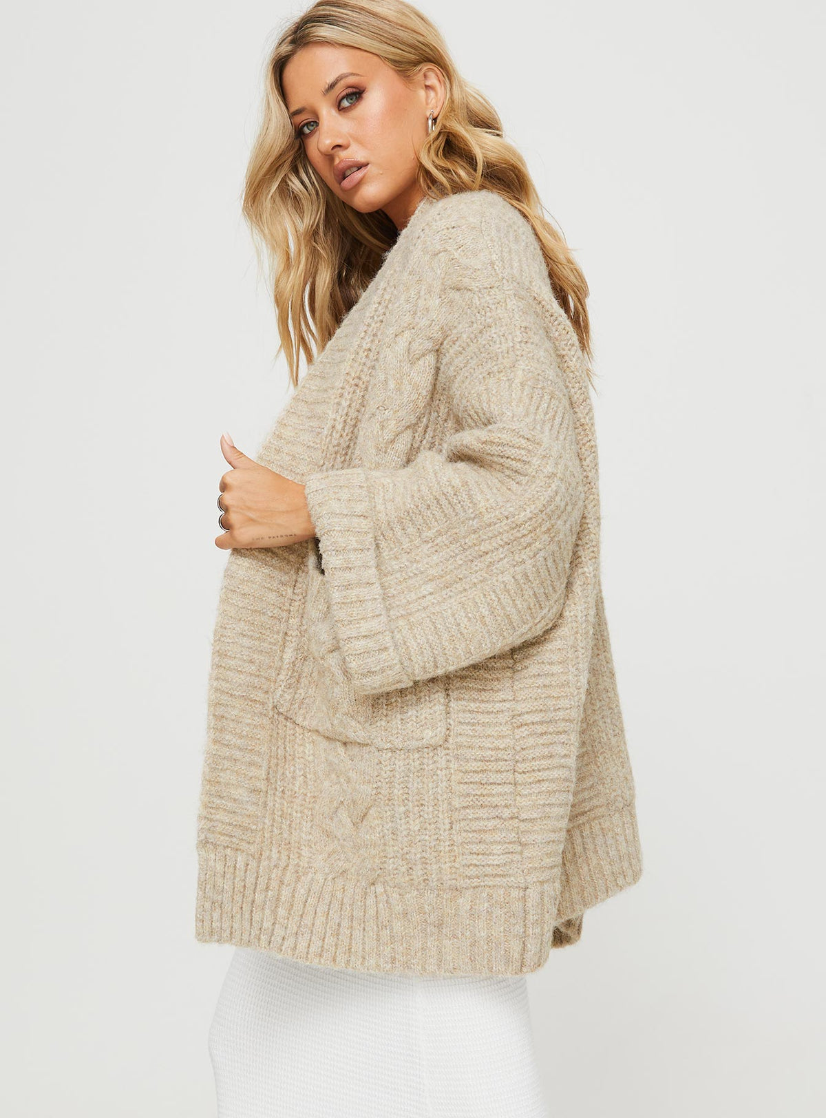 side view of model wearing Princess Polly Paisleigh Cable Knit Cardigan Beige 
