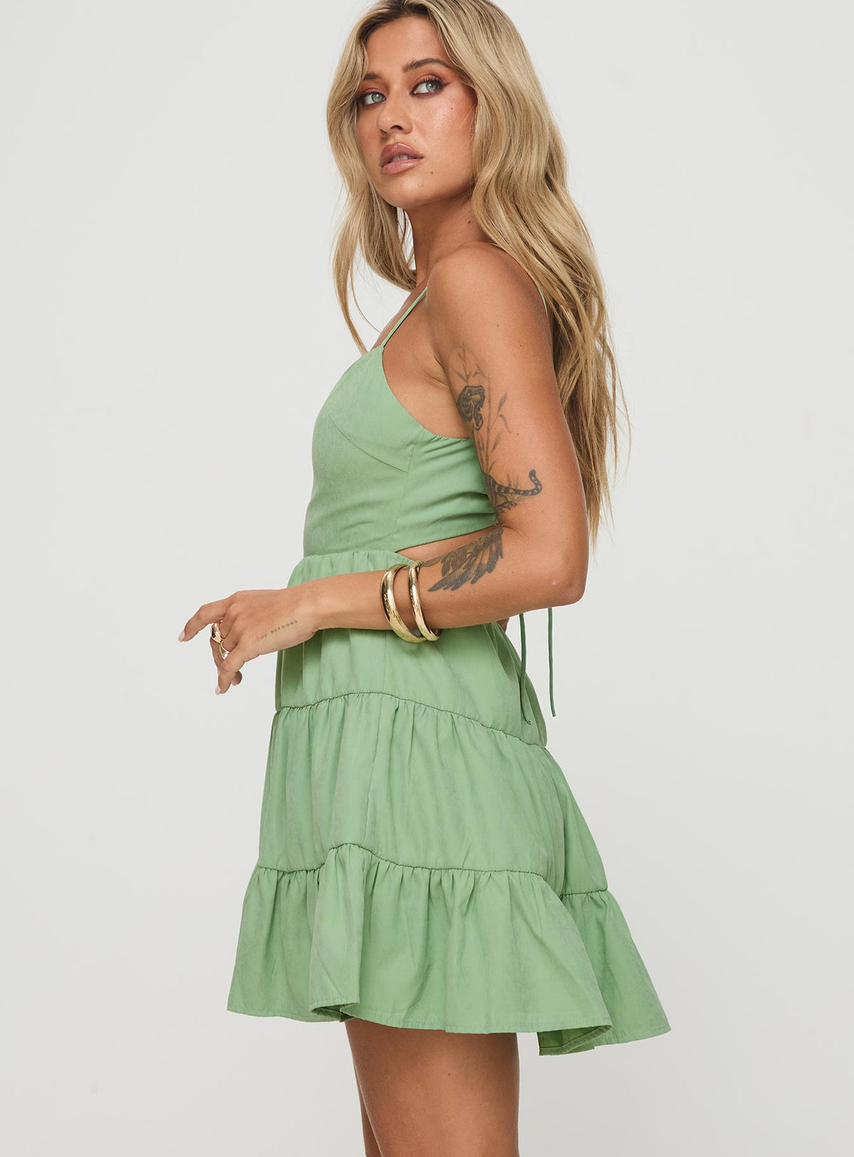 side view of model wearing Princess Polly Summer Break Mini Dress Sage Square Neck 