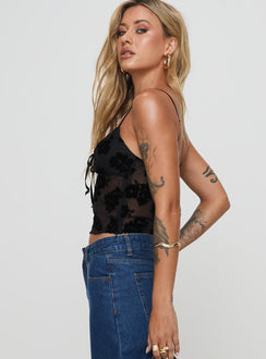 side view of model wearing Princess Polly Numb Top Black Sleeveless Plunger 