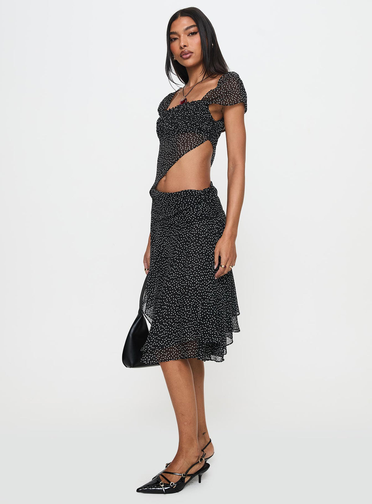   side view of model wearing Princess Polly Legacy Midi Skirt Onyx Polka Skirts 