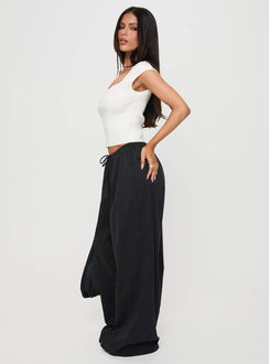 Designed with Bungala Oversized Relaxed Pants Black Tall wide-leg womens regular pants in mid-rise side view of model wearing Princess Polly