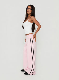 Showcasing Lockie Foldover Baggy Track Pants Pink / Black in womens regular pants with high-rise waist side view of model wearing Princess Polly