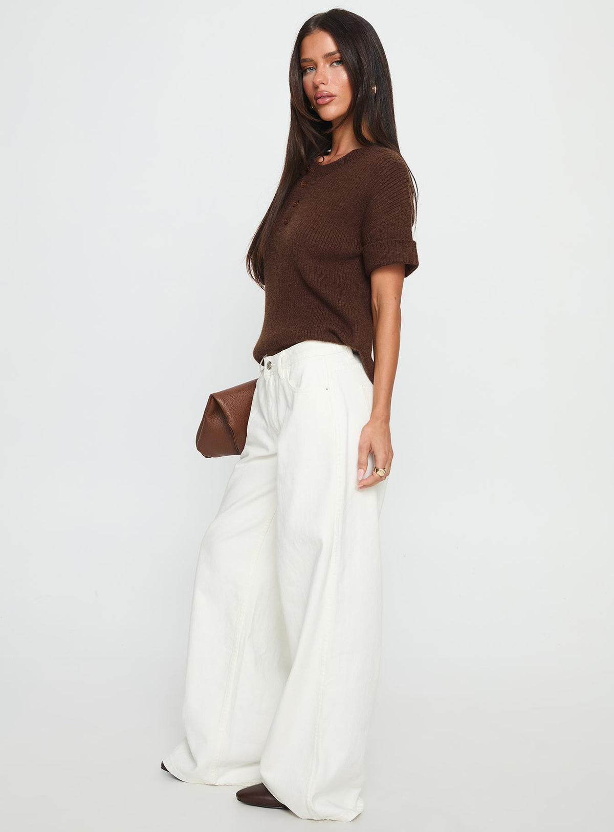 side view of model wearing Princess Polly Ramos Low Rise Wide Leg Jeans White Low Rise Jeans 