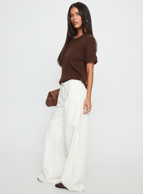 side view of model wearing Princess Polly Ramos Low Rise Wide Leg Jeans White Low Rise Jeans 